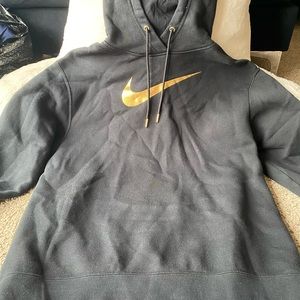 Black and Gold Nike hoodie.